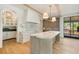 Modern kitchen featuring a large island, marble countertops, custom cabinetry, and stainless steel appliances at 1026 Reeder Cir, Atlanta, GA 30306