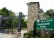 Entrance to Piedmont Park in Atlanta with stone arch and sign indicating park hours at 1026 Reeder Cir, Atlanta, GA 30306