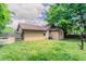 Backyard showing the grassy area, wooden fence, and part of the home's exterior at 1615 Enchanted Forest Dr, Conley, GA 30288