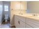 Bathroom vanity featuring double sinks, chrome fixtures and a large window, for natural light at 1615 Enchanted Forest Dr, Conley, GA 30288