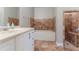 Bathroom featuring a white vanity, soaking tub, and tiled shower at 1615 Enchanted Forest Dr, Conley, GA 30288