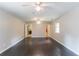 Spacious bedroom with hardwood floors and access to the kitchen at 1615 Enchanted Forest Dr, Conley, GA 30288