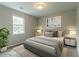 Cozy bedroom features a comfortable bed, stylish decor, and ample natural light from the window at 1615 Enchanted Forest Dr, Conley, GA 30288