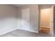 A well-lit bedroom includes a closet and doorway, offering convenient storage and access at 1615 Enchanted Forest Dr, Conley, GA 30288