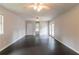 Large bedroom with hardwood floors, double closets, and a ceiling fan at 1615 Enchanted Forest Dr, Conley, GA 30288