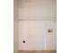 A practical laundry room features a shelf, utility connections, and durable tiled flooring for easy maintenance at 1615 Enchanted Forest Dr, Conley, GA 30288