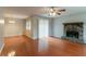 Spacious living room with hardwood floors and a stone fireplace at 1615 Enchanted Forest Dr, Conley, GA 30288