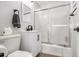 Bright bathroom featuring a vanity with storage, a modern shower with sliding doors, and neutral tones at 215 Piedmont Ne Ave # 2210, Atlanta, GA 30308