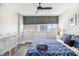 Comfortable bedroom with city views, nautical bedding, and ample natural light at 215 Piedmont Ne Ave # 2210, Atlanta, GA 30308