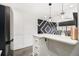 Stylish kitchen with white countertops, modern appliances, pendant lighting, and bar seating area at 215 Piedmont Ne Ave # 2210, Atlanta, GA 30308