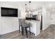 Modern kitchen featuring stainless steel appliances, white cabinetry, and breakfast bar with unique zebra-print bar stools at 215 Piedmont Ne Ave # 2210, Atlanta, GA 30308