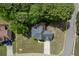 Overhead view of a home with well-kept lawn and border, showing backyard deck and trees at 4290 Grand Teton Pkwy, Suwanee, GA 30024