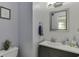 Powder room features a modern vanity, mirror, and stylish decor at 4290 Grand Teton Pkwy, Suwanee, GA 30024