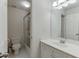Bright bathroom featuring white cabinets, tile flooring, shower and tub combination at 4290 Grand Teton Pkwy, Suwanee, GA 30024