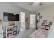 Bedroom with a view of a bathroom through one door and the top of the stairs through another at 4290 Grand Teton Pkwy, Suwanee, GA 30024