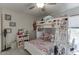 Bedroom with bunkbeds, toys, and storage shelves for a  at 4290 Grand Teton Pkwy, Suwanee, GA 30024