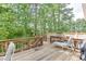 Relaxing deck with wooded views featuring lounge chair and other seating at 4290 Grand Teton Pkwy, Suwanee, GA 30024