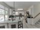 Bright, eat-in kitchen with white cabinets, stainless steel appliances, and ample natural light from the windows at 4290 Grand Teton Pkwy, Suwanee, GA 30024