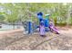 Colorful community playground with slides, climbing wall, and a mulch ground cover at 4290 Grand Teton Pkwy, Suwanee, GA 30024