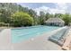 Community pool surrounded by lounge chairs, umbrellas, and a clubhouse at 4290 Grand Teton Pkwy, Suwanee, GA 30024
