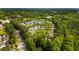 Aerial view of neighborhood, displaying mature trees and residential streets near community landscape at 5134 Pratt Sw St, Covington, GA 30014