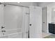 Clean bathroom with a tub, white subway tile surround, and a shower with a white curtain at 5134 Pratt Sw St, Covington, GA 30014