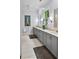 Bright bathroom with double vanity, modern fixtures, and ample storage space at 5134 Pratt Sw St, Covington, GA 30014