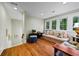 Cozy bonus room with natural light, comfortable seating, and hardwood floors at 5134 Pratt Sw St, Covington, GA 30014