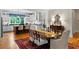 Open-concept dining area featuring hardwood floors, elegant decor, and ample seating for Gathering meals at 5134 Pratt Sw St, Covington, GA 30014