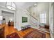 Elegant foyer with hardwood floors, staircase, and ample natural light, creating a welcoming entrance at 5134 Pratt Sw St, Covington, GA 30014