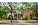 Inviting two-story home with a classic white exterior, complemented by dark shutters and lush landscaping at 5134 Pratt Sw St, Covington, GA 30014