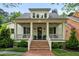 Attractive two-story home featuring a covered front porch with stylish columns and a well-maintained brick walkway at 5134 Pratt Sw St, Covington, GA 30014