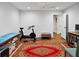 Workout room with an exercise machine, massage table, and ample space for various fitness activities at 5134 Pratt Sw St, Covington, GA 30014