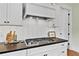 Modern kitchen with gas range and white cabinets at 5134 Pratt Sw St, Covington, GA 30014