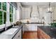 Bright kitchen with black countertops and stainless steel faucet at 5134 Pratt Sw St, Covington, GA 30014