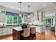 Updated kitchen with island, pendant lighting, and stainless appliances at 5134 Pratt Sw St, Covington, GA 30014