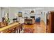 Spacious open-concept living room with hardwood floors, fireplace, and elegant furnishings, perfect for gatherings at 5134 Pratt Sw St, Covington, GA 30014