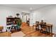 Open living area with hardwood floors, an entertainment center, and lots of natural light at 5134 Pratt Sw St, Covington, GA 30014