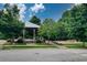Community playground with a gazebo and swing set, nestled amongst mature trees and green space at 5134 Pratt Sw St, Covington, GA 30014
