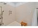 Elegant walk-in shower features neutral tile, modern fixtures, and a built-in niche at 5134 Pratt Sw St, Covington, GA 30014