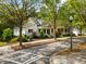 Quaint two-story home with a charming front porch nestled among mature trees on a quiet street at 5134 Pratt Sw St, Covington, GA 30014