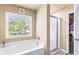This bathroom includes a soaking tub and a separate walk-in shower at 635 Crosswinds Cir, Marietta, GA 30008