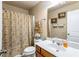 Full bathroom with shower and tub combination, vanity, and decorative floral shower curtain at 635 Crosswinds Cir, Marietta, GA 30008