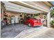 The garage includes an organization system, a refrigerator, and a red car at 635 Crosswinds Cir, Marietta, GA 30008