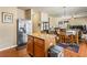 Eat-in kitchen featuring stainless steel appliances, an island with granite countertops, and wooden cabinetry at 635 Crosswinds Cir, Marietta, GA 30008