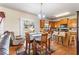 Bright eat-in kitchen featuring wood cabinets, a breakfast bar, and sliding glass doors to the outdoor space at 635 Crosswinds Cir, Marietta, GA 30008