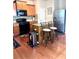 Efficient kitchen featuring updated appliances, a breakfast bar, and hardwood floors at 635 Crosswinds Cir, Marietta, GA 30008