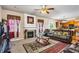 Spacious living room features a fireplace, large windows, and a view of the kitchen at 635 Crosswinds Cir, Marietta, GA 30008