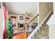 Cozy living room with a fireplace, staircase, hardwood floors, and comfortable seating at 635 Crosswinds Cir, Marietta, GA 30008