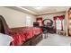 This main bedroom has a large wood bed frame, dresser, and decor at 635 Crosswinds Cir, Marietta, GA 30008